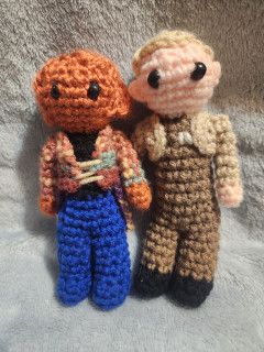 A photo of two crocheted dolls of Quark and Odo from Star Trek: Deep Space Nine.